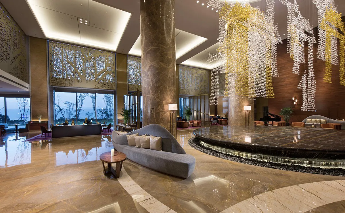 Grand hotel lobby with marble columns and luxury interior decor