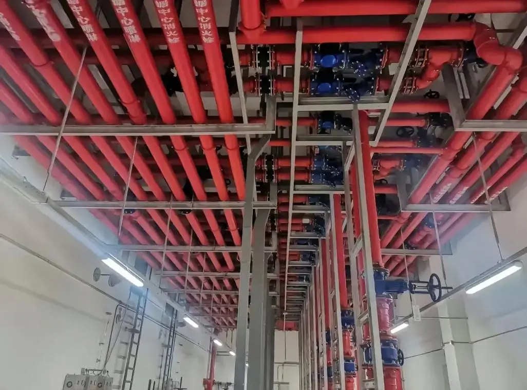 Overhead industrial dry pipe fire sprinkler piping network for cold storage warehouse fire protection
