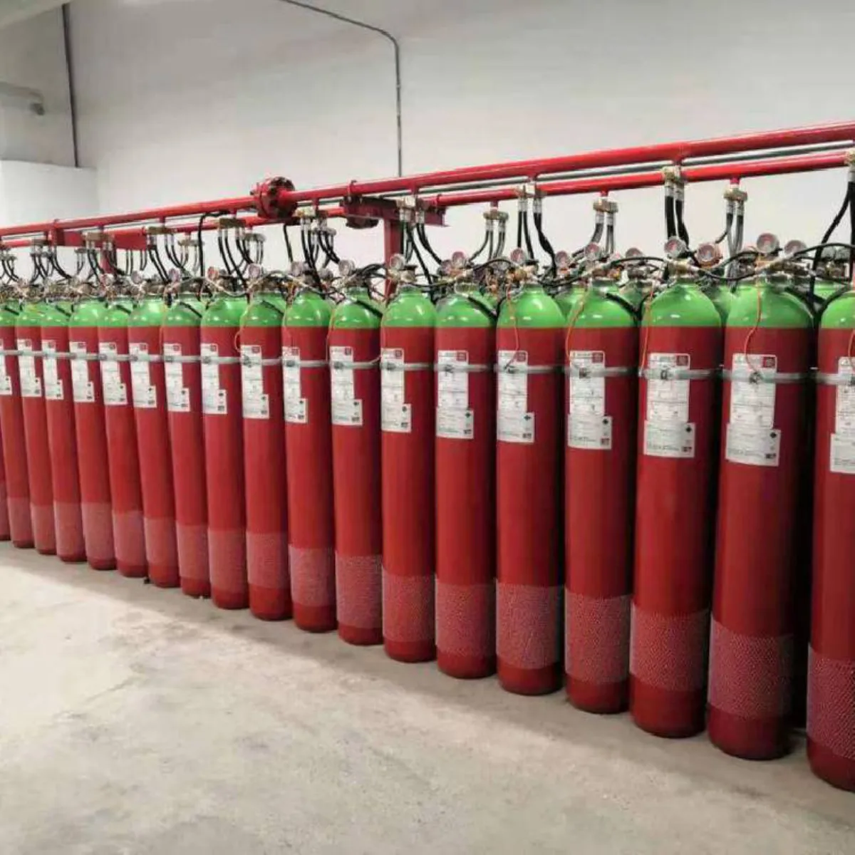 Red FM-200 and Novec 1230 clean agent gas cylinders for server room and data center fire protection